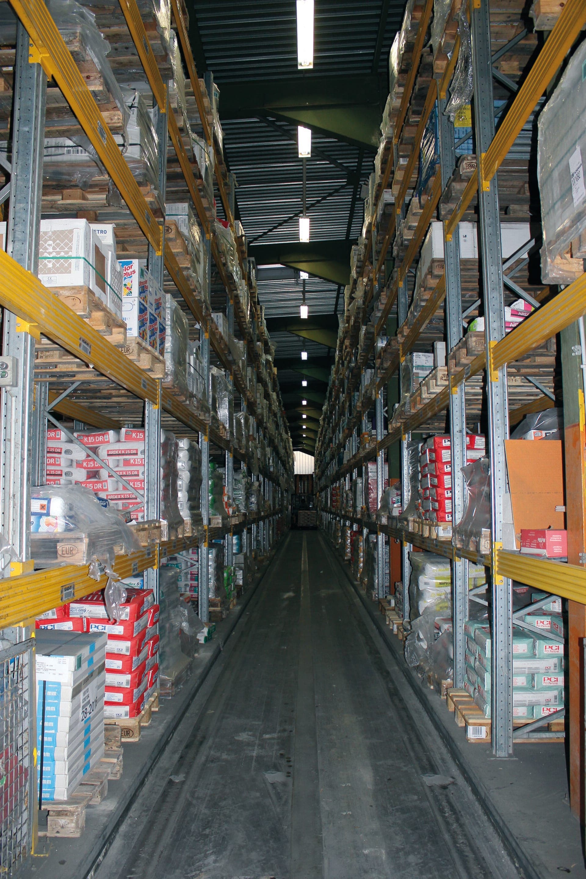 High-bay warehouse aisle with racking systems